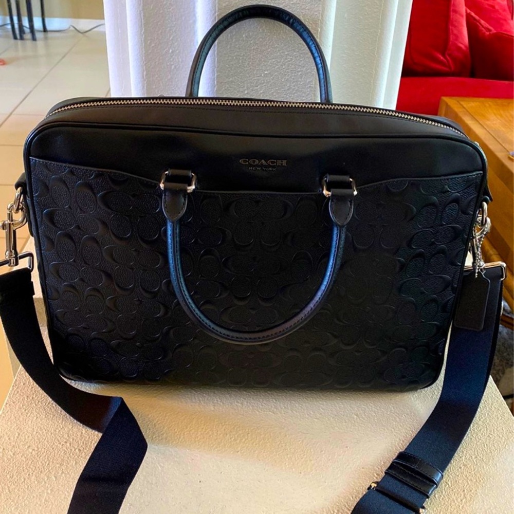 Coach Unisex laptop leather bag W/TAG Bought it and was too big for my laptop.
